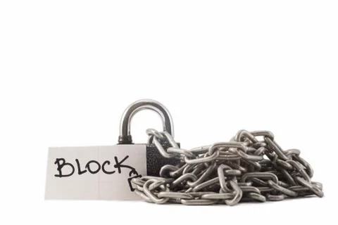 Padlock on a white background. The lock is locked. The chain is metal. Stock Photos