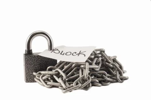 Padlock on a white background. The lock is locked. The chain is metal. Stock Photos