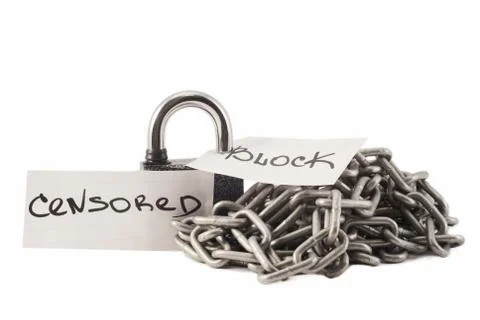 Padlock on a white background. The lock is locked. The chain is metal. Stock Photos