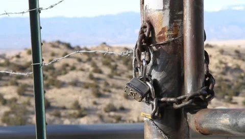 Padlocked Fence Near Border Crossing Stock Footage