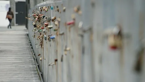 Padlocks attached to a bridge railing in Wellington, New Zealand Stock Footage 89892857
