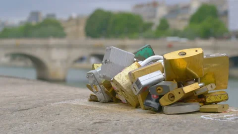 Padlocks on the bridge of lovers in Paris in 4k 動画素材 165589437