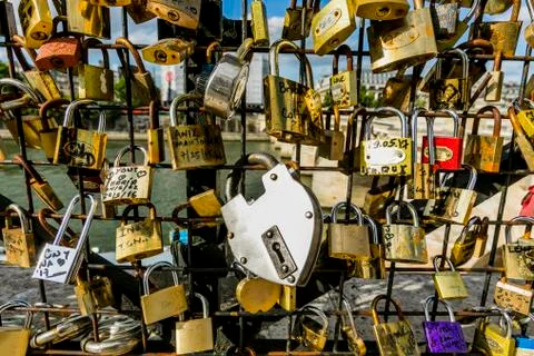 Padlocks on fence at river Stock Photos