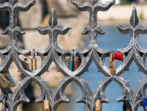 Padlocks or love locks affixed to a old metal fence in Prague 스톡 사진