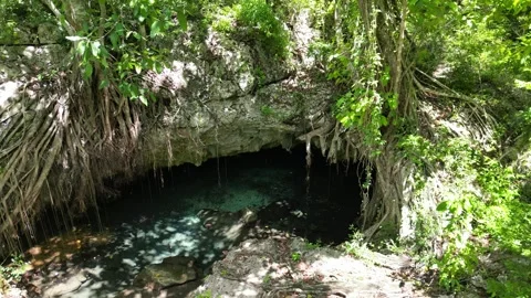 Padre-nuestro-cave-drone-4k-aerial-limestone-cave-and-emerald-water-04 Stock Footage 316791445