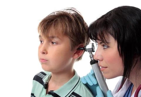 Paediatrician checking ears Stock Photos