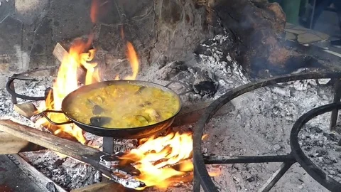 Paella cooking on fire Stock Footage 82471884