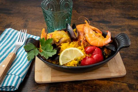 Paella dish on a table Stock Photos