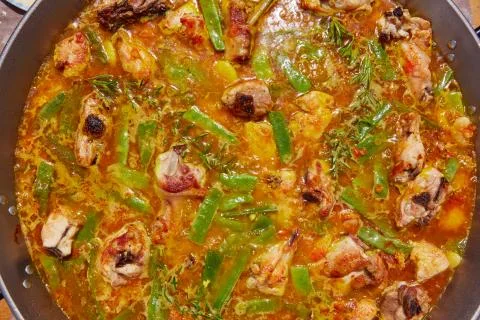 Paella from Spain recipe process boiling broth Stock Photos