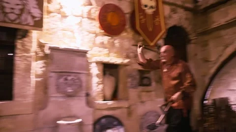 Pagan axe throwing concept; Medieval wild viking heathen man throws axe in old Stock Footage 297351203