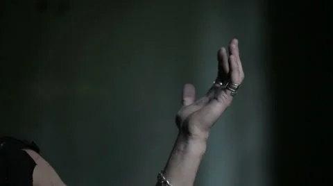 Pagan prayers and raises his hands up. Slow motion Stock Footage 49847018