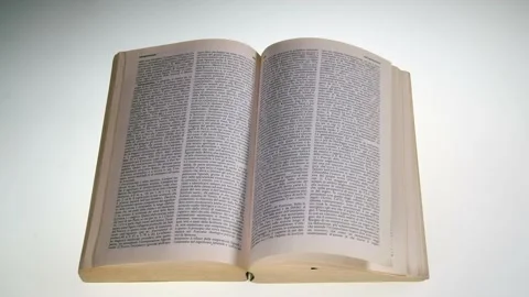 The page of a book turns by itself Stock Footage 165951860
