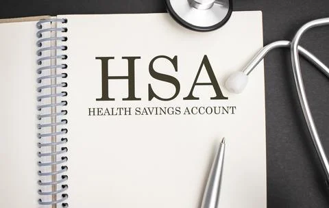Page with HSA Health Savings Account on the table with stethoscope, medical c Stock Photos