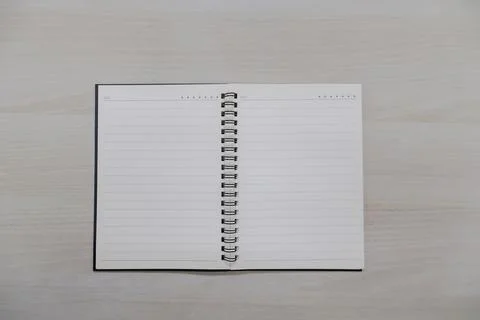 Page lined notebook on wooden table background Stock Photos