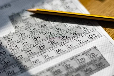  Page with the periodic table of the elements on the desk, pencil on the r... Stock Photos