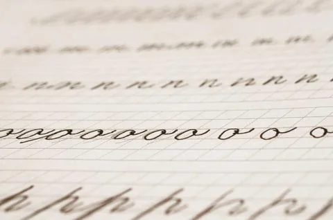 Page of a school notebook with handwritten letters of the English alphabet Stock Photos