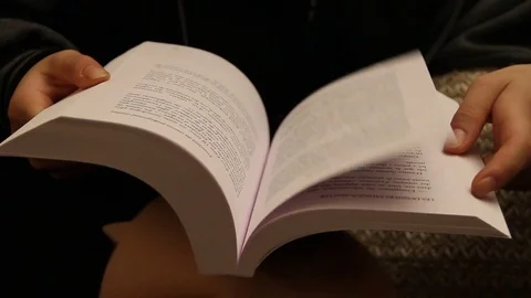 Page turning on a book Stock Footage 79046327