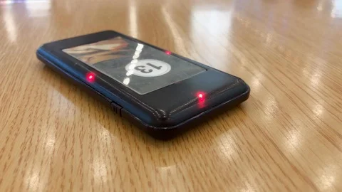 Pager on table vibrates and blinks, signaling to pickup the order Video stock 126589248