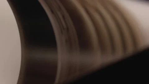 Pages in a book being paged through Stock Footage 136035866