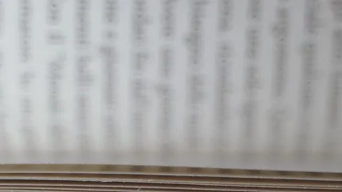 Pages of a book turn quickly, slow motion macro shot Stock Footage 133210724