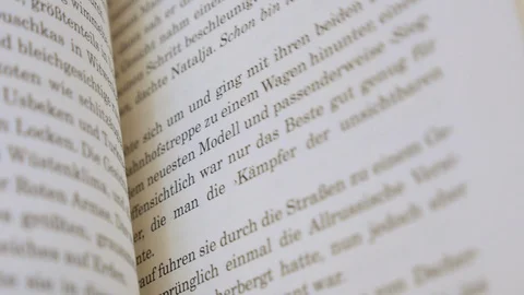 The pages of a German language book are flipped through Video stock 108603065
