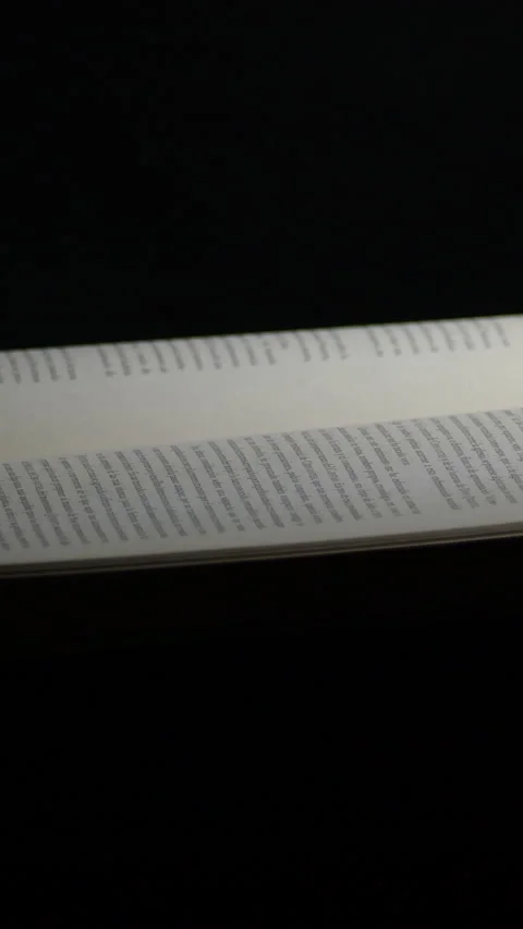 Pages of open book with black background, rotation. 4K Vertical Video stock 204806948