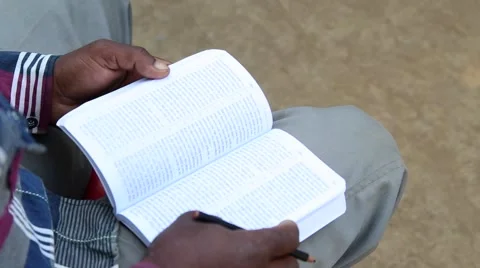 Paging through a book Stock Footage 65787056