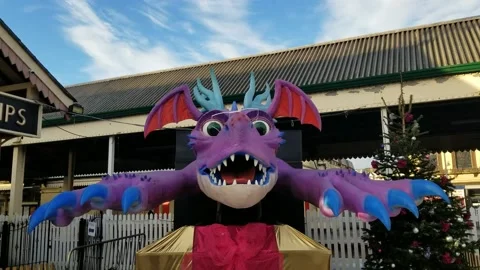 Paignton, Devon: An animatronic dragon outside train station (AUDIO: Roaring) Stock Footage 226553836