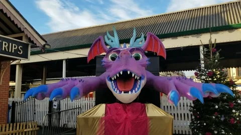 Paignton, Devon: An animatronic dragon outside train station (AUDIO: Roaring) Stock Footage 226553838