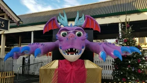 Paignton, Devon: An animatronic dragon outside train station (AUDIO: Roaring) Stock Footage 226553855