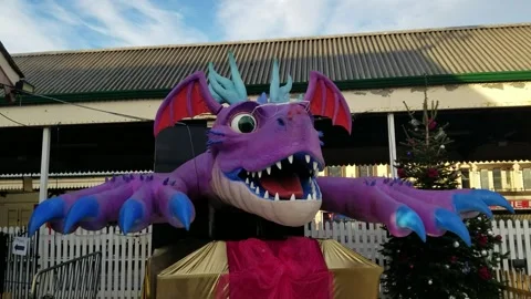 Paignton, Devon: An animatronic dragon outside train station (AUDIO: Roaring) Stock Footage 226555219