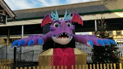 Paignton, Devon: An animatronic dragon outside train station (AUDIO: Roaring) Stock Footage 226555222