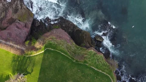 Paignton, Devon, England: Drone View: Fairy Cove cliffs and sea Stock Footage 197507686