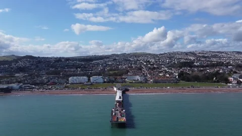Paignton, Devon, England: Drone View: Paignton pier with town in the background Stock Footage 198500210