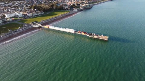 Paignton, Devon, England: Drone View: The pier, green and Preston Sands Stock Footage 198502132