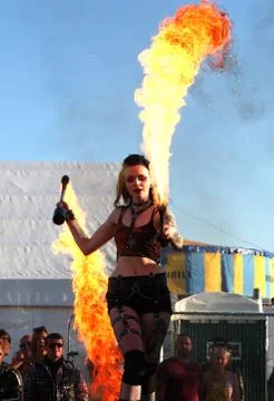 Paignton, Devon, England: A fire-eater / dancer performs on stage 스톡 사진