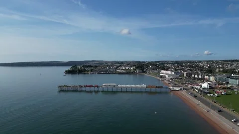 Paignton, S. Devon, England: DRONE VIEWS: Paignton Pier, the Green &amp; Coastline Stock Footage 246538917