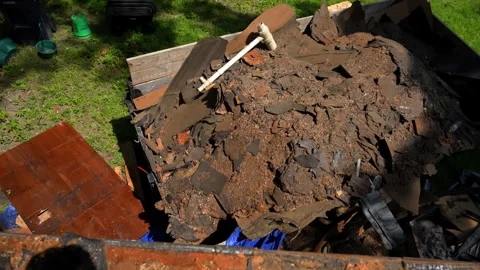 Pail of building demolition debris in the dump truck during repair renovation Stock Footage 342690151