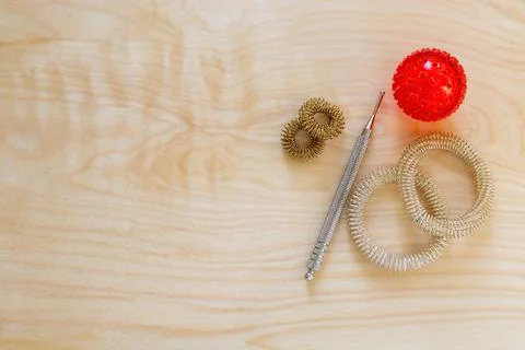 Pain points stimulation stuff with Su Jok. Sujok massage tools background Stock Photos