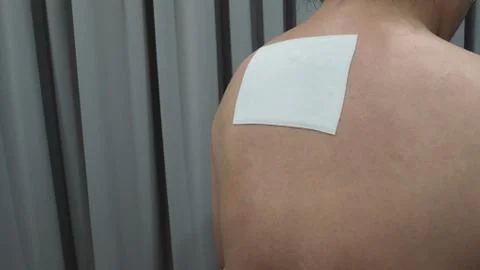 Pain Relief Patch or plaster on man's Back From Japan. Fotos de archivo