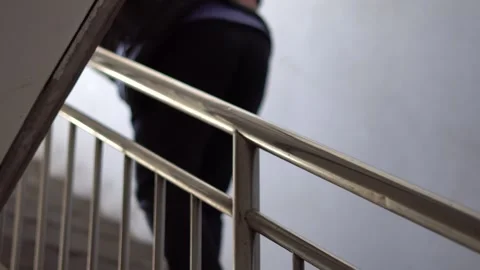 Pain in waist and legs, difficulty walking up stairs Stock Footage 159063892