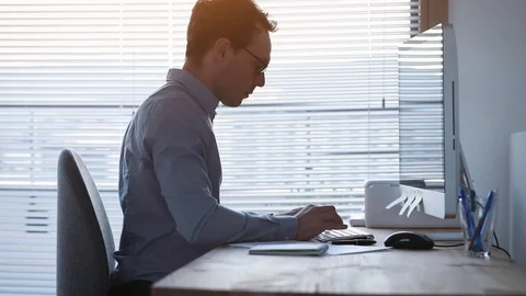 Pain in wrist after working on computer keyboard, business man in office Stock Footage 127370190