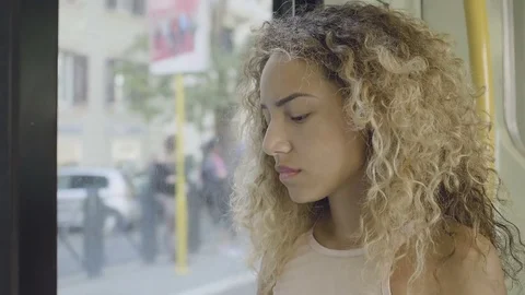 Painful day in the bus: young sad woman portrait on the bus in the city Stock Footage
