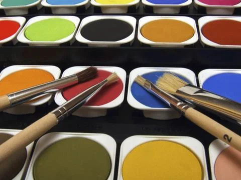 Paint and brushes Stock Photos