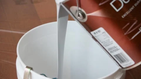Paint Being Poured into a Bucket Stock Footage 247508929
