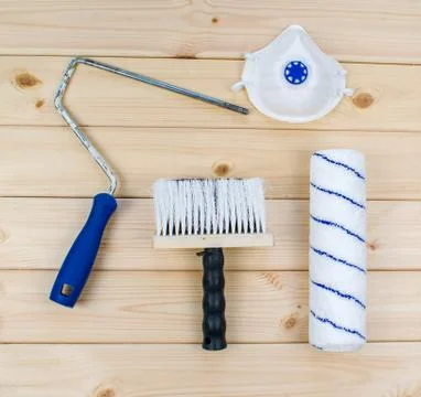 Paint brush and roller with plastic handle and soft velour nozzles with medic Stock Photos