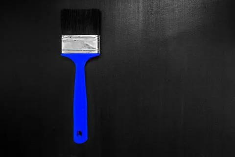Paint brush on a black background Stock Photos