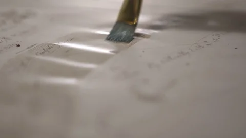 Paint brush draw ancient map with transparent light brown watercolor, close-up Video stock 94761961