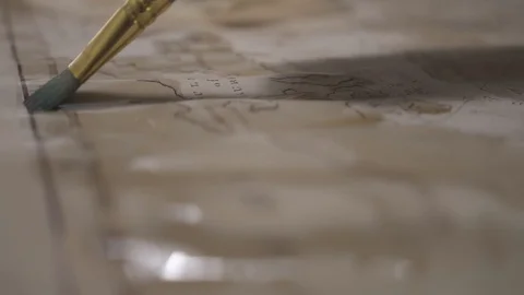 Paint brush draw ancient map with transparent light brown watercolor, close-up Stock-Footage 94764752