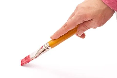 Paint brush in hand Stock Photos